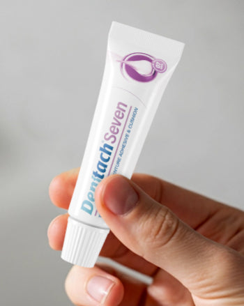 Denttach Seven tube held in a hand
