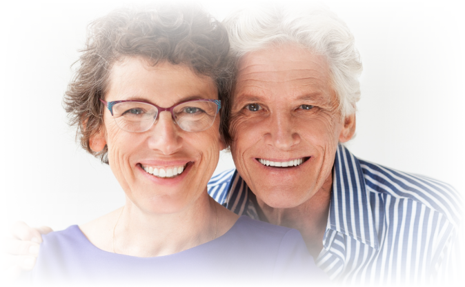 older couple smiling with dentures
